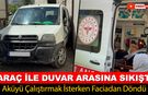 AKÜYÜ ÇALIŞTIRMAK İSTERKEN ARAÇ İLE DUVAR ARASINA SIKIŞTI