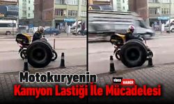 MOTOKURYENİN KAMYON LASTİĞİ İLE MÜCADELESİ KAMERALARDA