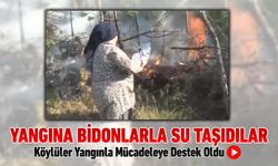 BİDONLARLA SU TAŞIYIP YANGINA MÜDAHALE ETTİLER