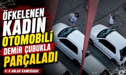 ÖFKELENEN KADIN OTOMOBİLİ DEMİR ÇUBUKLA PARÇALADI