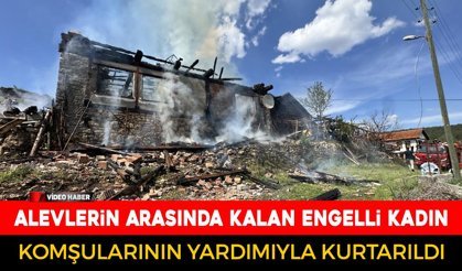 ALEVLERİN İÇİNDE KALAN ENGELLİ KADINI KOMŞULARI KURTARDI
