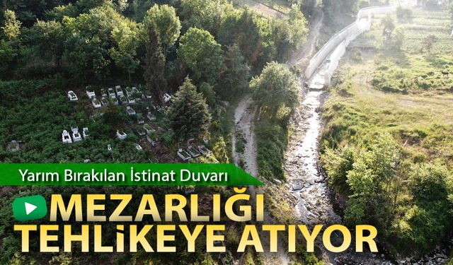 YARIM KALAN İSTİNAT DUVARI MEZARLIĞI TEHLİKEYE ATIYOR