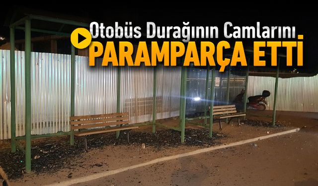 OTOBÜS DURAĞININ CAMLARINI TAŞLADI